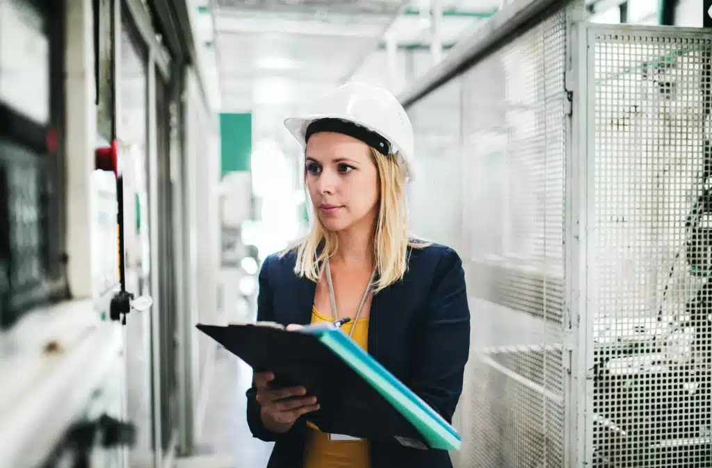woman in hard hat with checklist