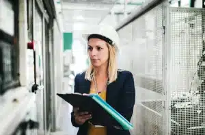 woman in hard hat with checklist