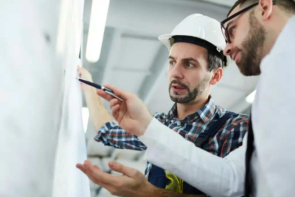 men looking at a board