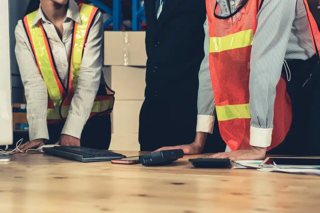 group of people in high vis at a table