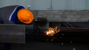 man welding on construction site