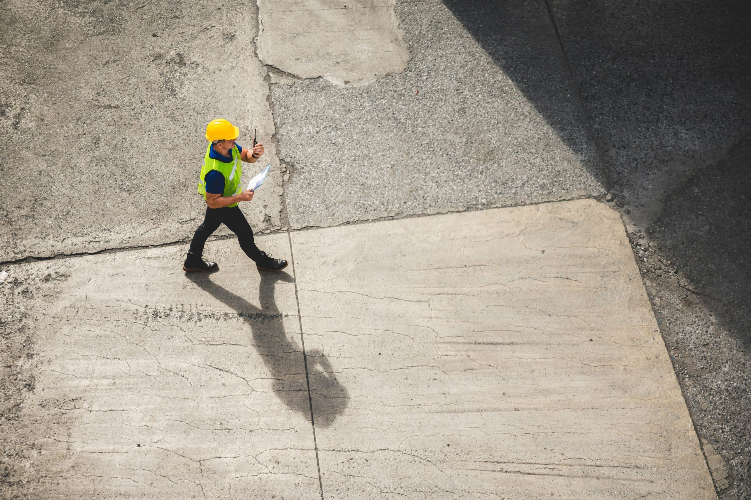 Man in hi-vis and safety helmet