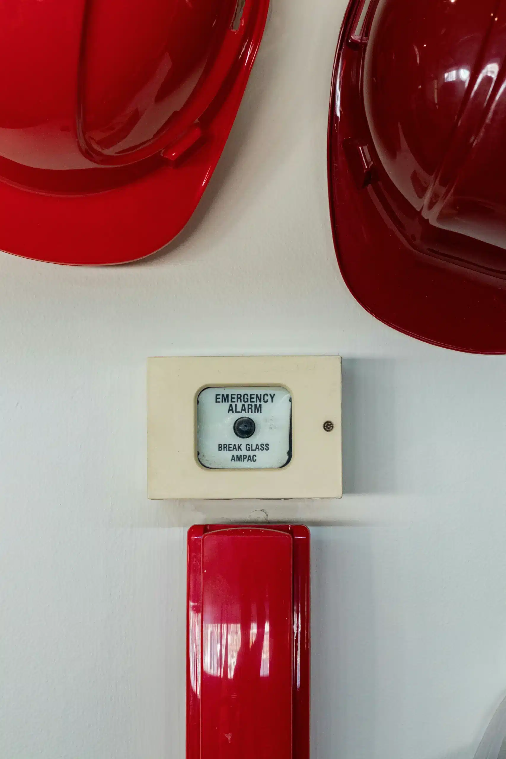 fire alarm with red hard hats