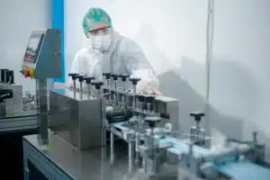 person in laboratory wearing ppe