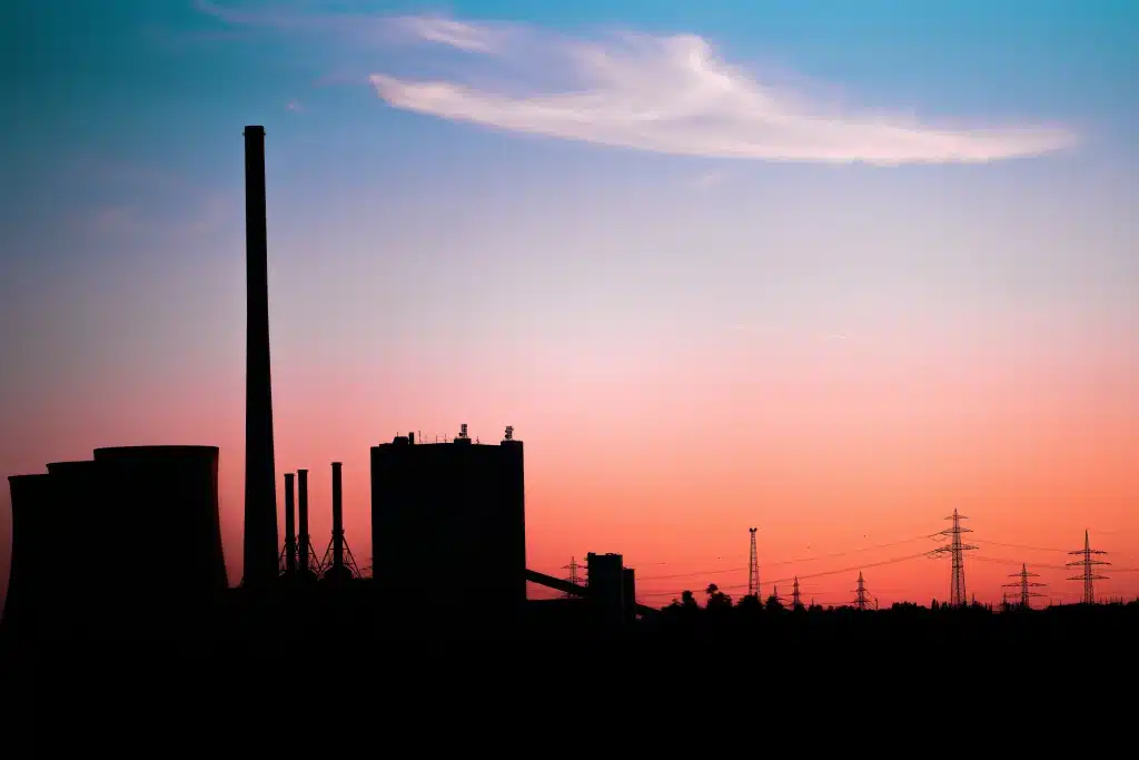 factory in background with pink sky