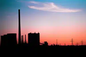 factory in background with pink sky