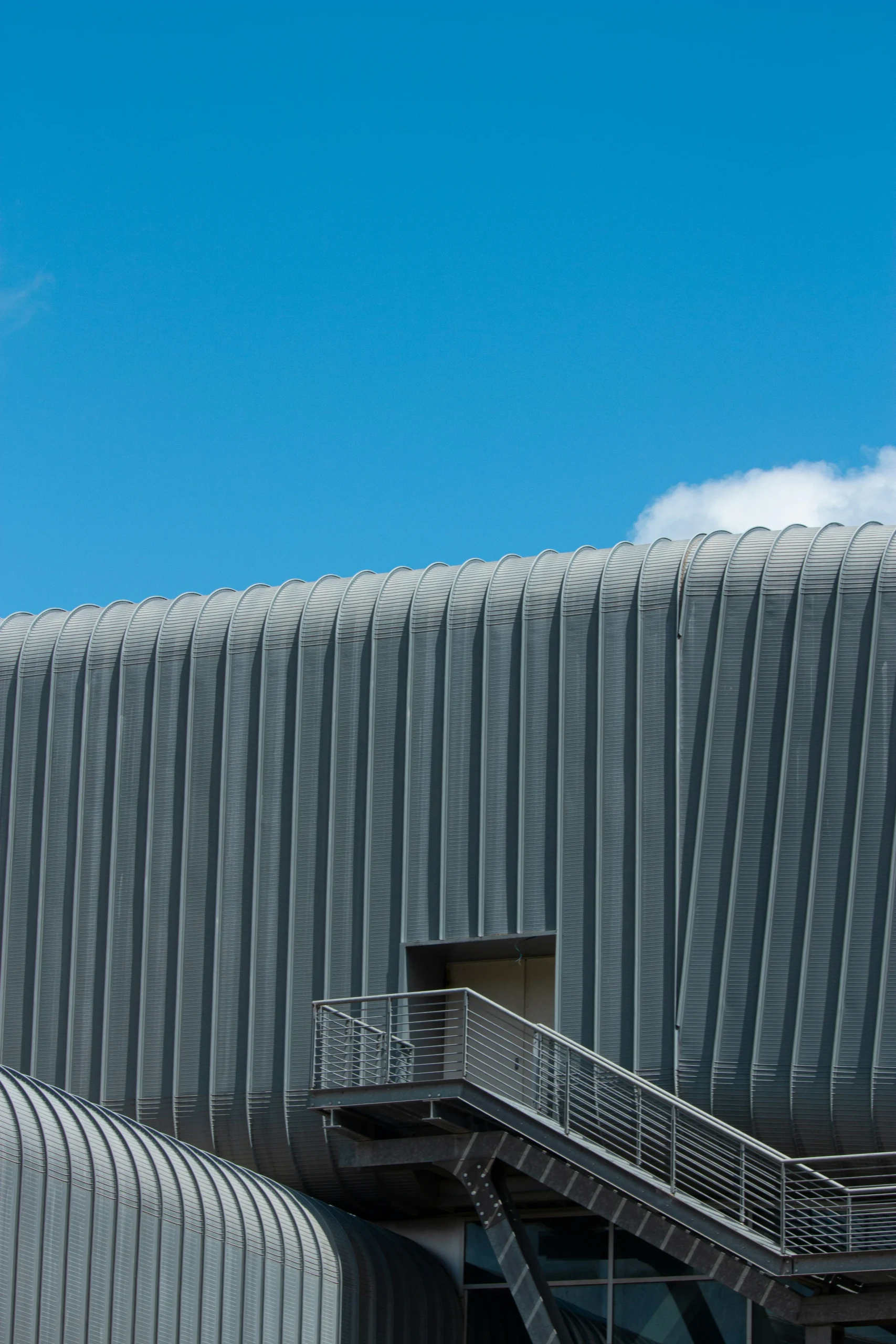 grey building with blue sky