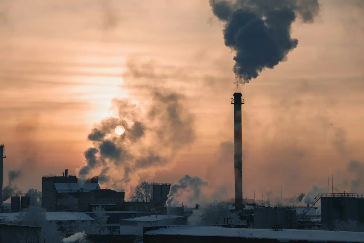 Paint, coating and adhesives explosion prevention factory with smoke and orange sky