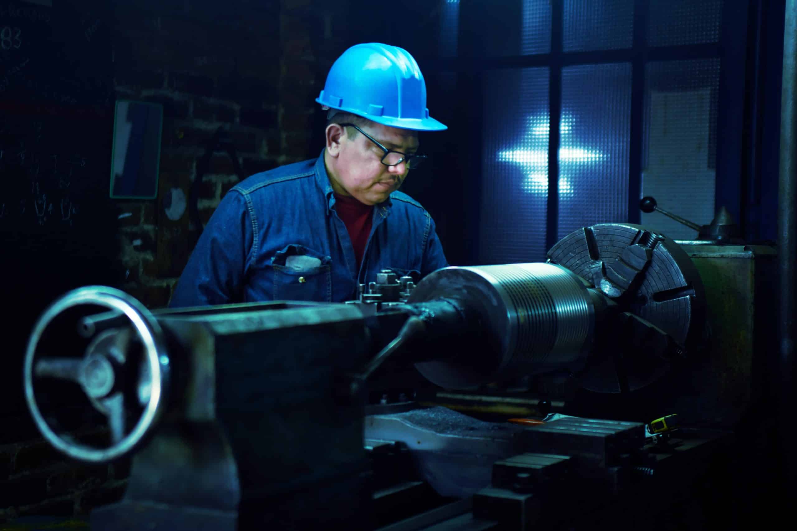man by piece of machinery