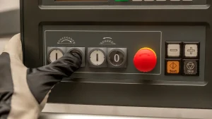Hand in glove pressing an on button
